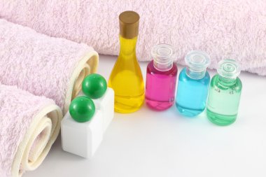 Bottles of color oil from spa room. clipart