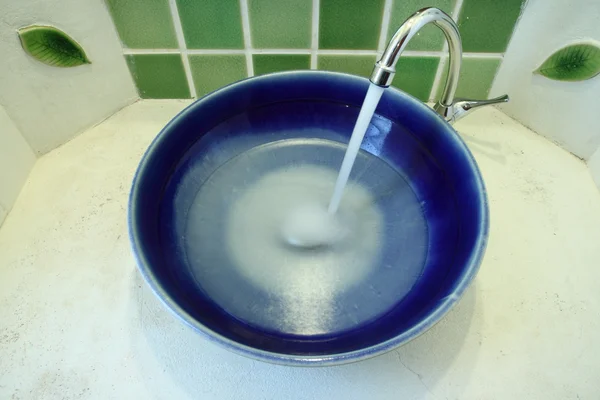 Water half ceramic basin with stream opened valve. — Stock Photo, Image