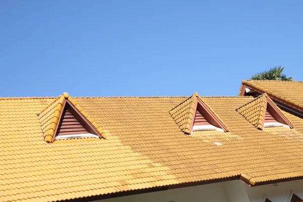 Gable on the yellow roof. — Stock Photo, Image