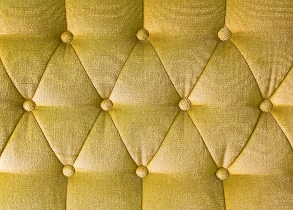 Текстура из жёлтой ткани винтажный диван для фона — стоковое фото