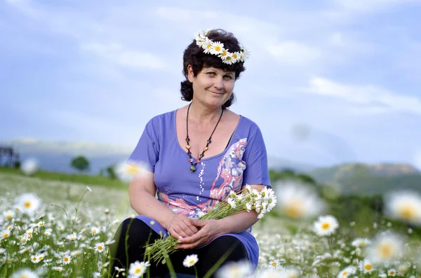 stock image Woman in camomile field