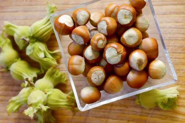 Stock image Nuts on wood table