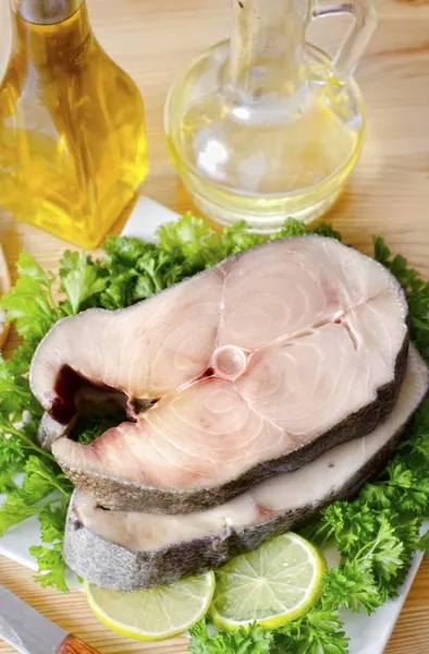 Raw fish on plate — Stock Photo, Image