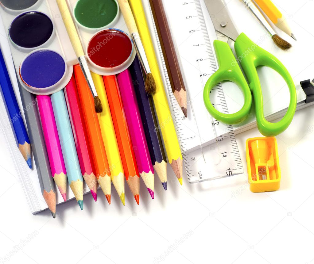 Assorted school supplies, including pens, pencils, scissors, glue and a rul