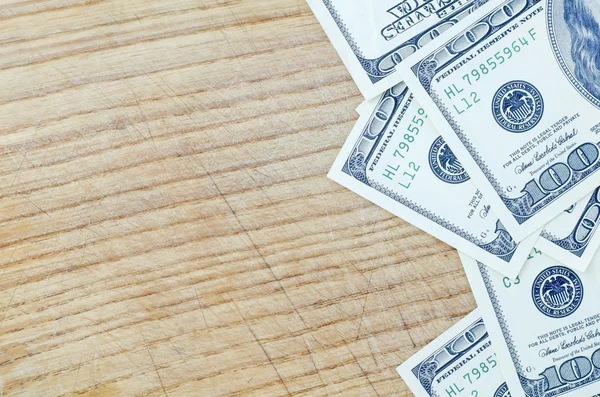 Banconote in dollari su legno — Foto Stock