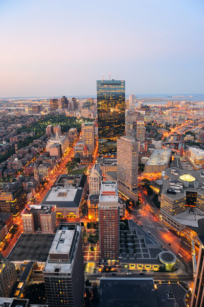 Urban city aerial view. Boston aerial view with skyscrapers at sunset with city downtown skyline.