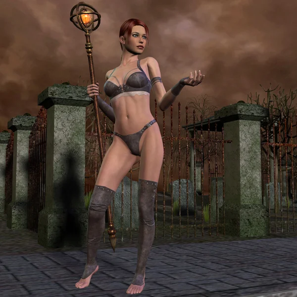 Young sorceress in front of cemetery — Stock Photo, Image