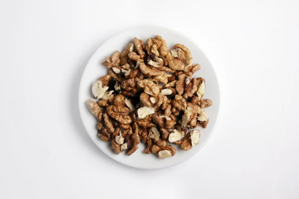 stock image Shelled nuts on a white plate.