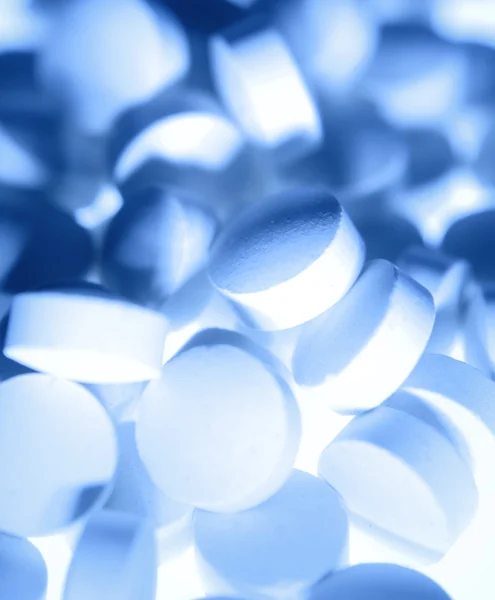 Primo piano di mucchio di pillole blu — Foto Stock
