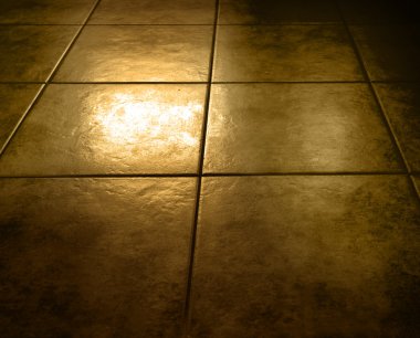 Closeup of grungy brown floor tiles clipart