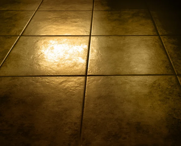 Fechar-se de azulejos piso marrom grungy — Fotografia de Stock