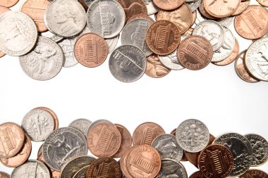 Closeup of American coins on plain background clipart