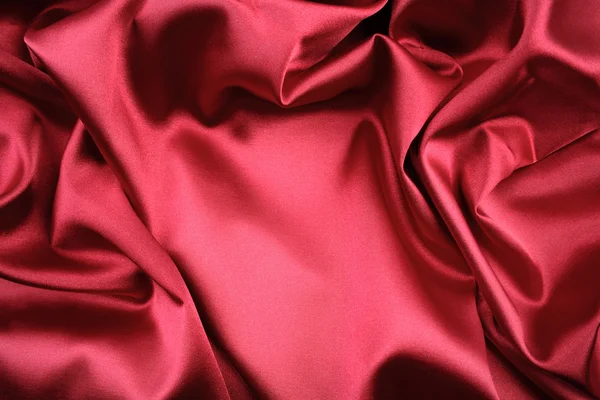 红色真丝织物中褶皱的特写 — 图库照片