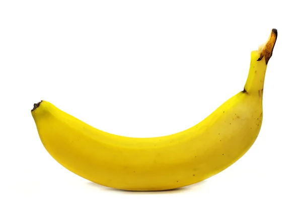 Un plátano amarillo aislado en un fondo blanco Imágenes de stock libres de derechos