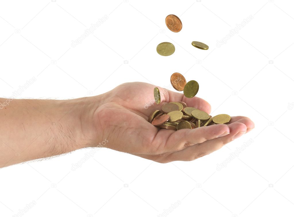 Coins falling in a hand in a white background