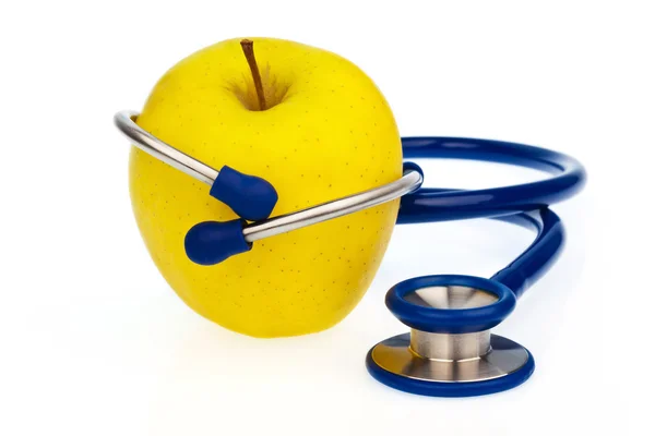 stock image A stethoscope and an apple