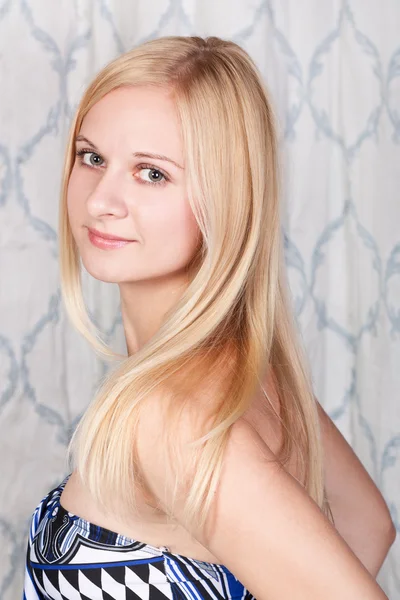 Charming young lady with pretty blond hair — Stock Photo, Image