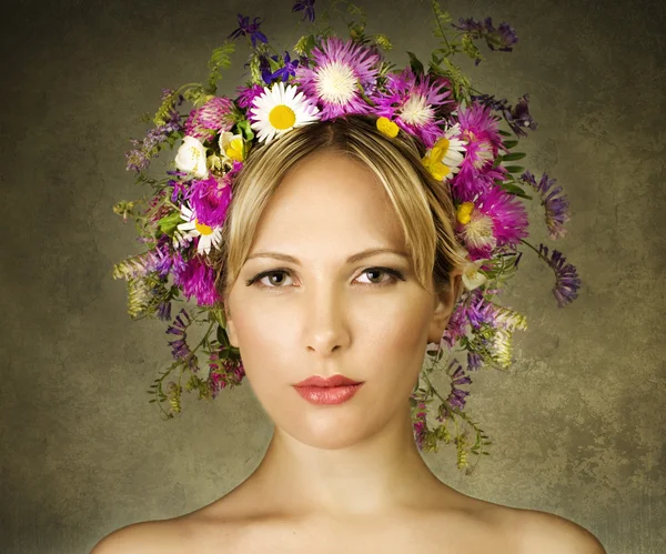 Woman with flowers on her head — Stock Photo, Image