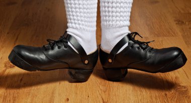 Feet in step shoes and white socks clipart