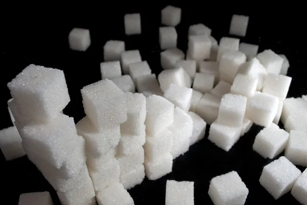 stock image Pile of white sugar cubes