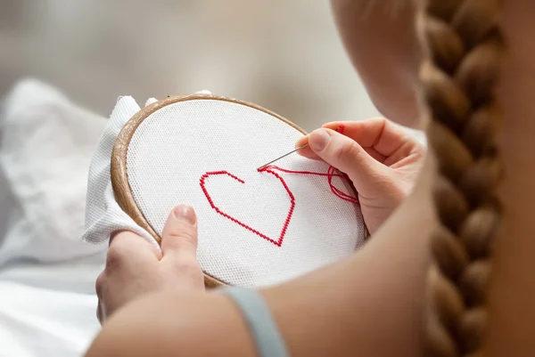 stock image Embroidering girl