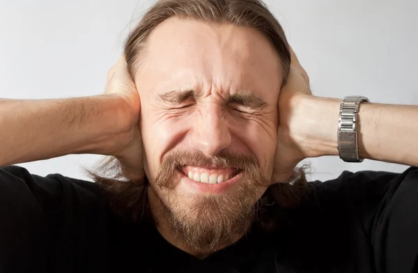 stock image Man holding his ears