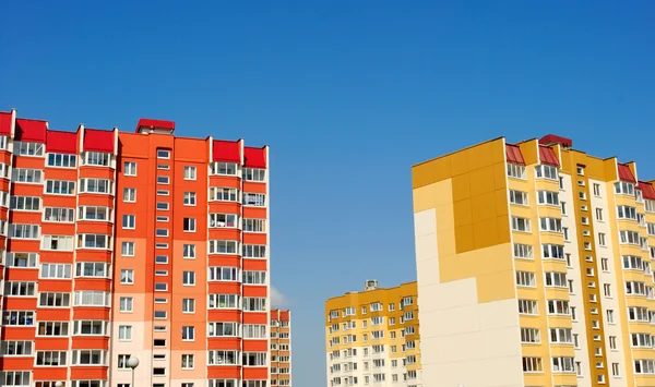 stock image Multistory yellow and red houses