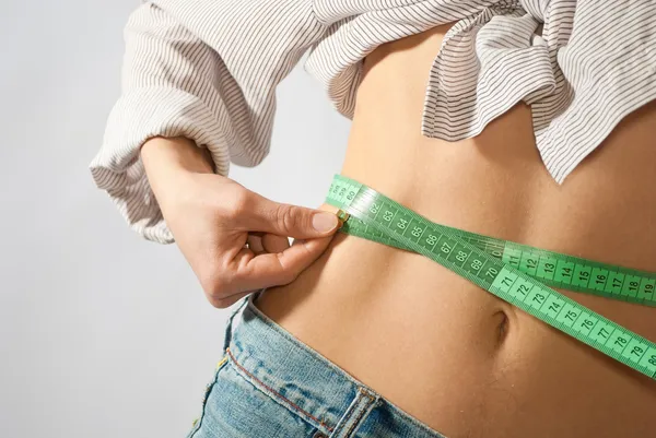 Waist being measured Royalty Free Stock Photos