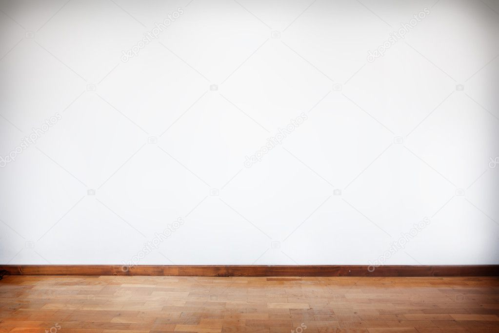 Empty room with wooden parquet