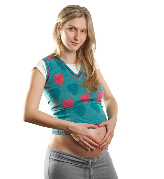 Anbud gravid kvinna med hjärtat — Stockfoto