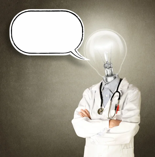 Доктор с головкой лампы и пузырьком комиксов — стоковое фото