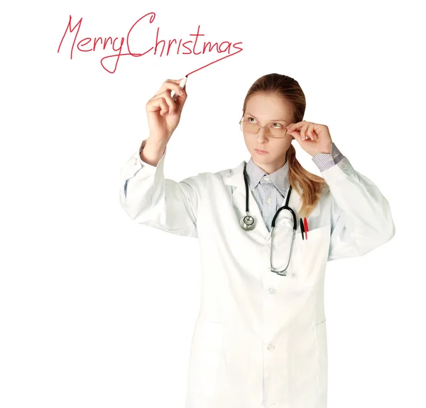Médico mulher escrevendo Feliz Natal — Fotografia de Stock