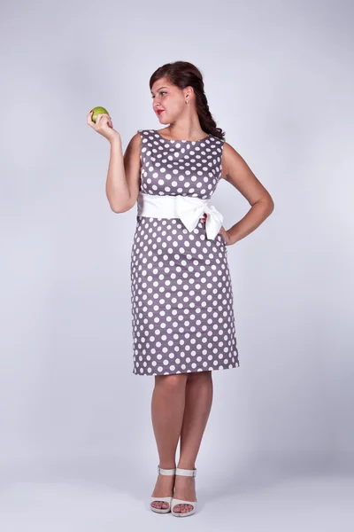 Retro girl with an apple — Stock Photo, Image