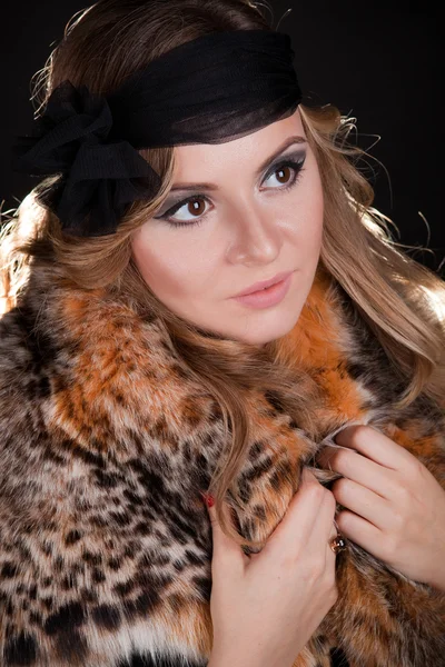 Young beautiful woman in black hat — Stock Photo, Image