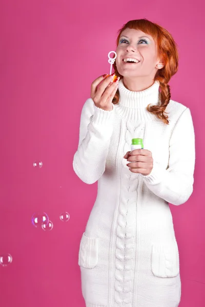 Red-haired girl in a white sweater — Stock Photo, Image