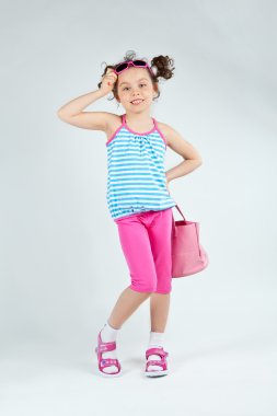 Little girl posing in studio clipart