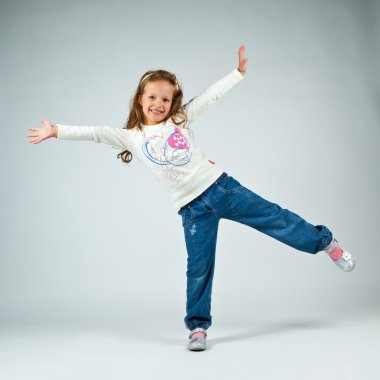 Little girl posing in studio clipart