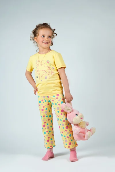 Cute little girl in yellow pijama — Stock Photo, Image