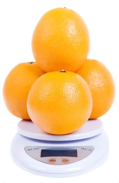 Oranges on scale — Stock Photo, Image