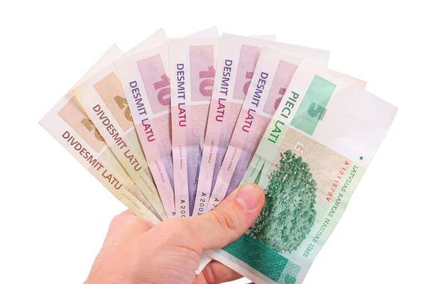 Ręka z pieniędzy-łotewski — Zdjęcie stockowe