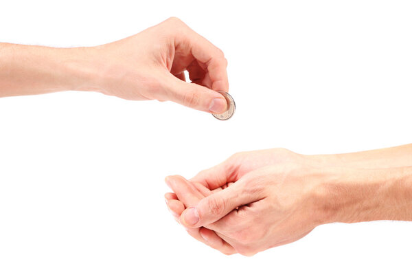 Hand gives coin to beggar