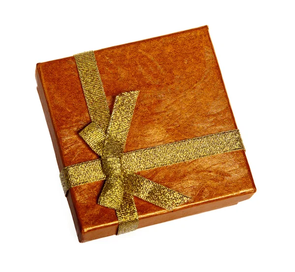 Vánoční krabice zlaté stužkou — Stock fotografie