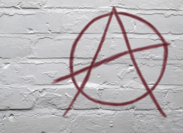 stock image Red Anarchy Symbol on White Wall