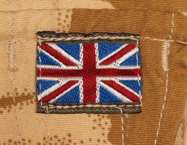 British Army Badge on Desert Camouflage clipart