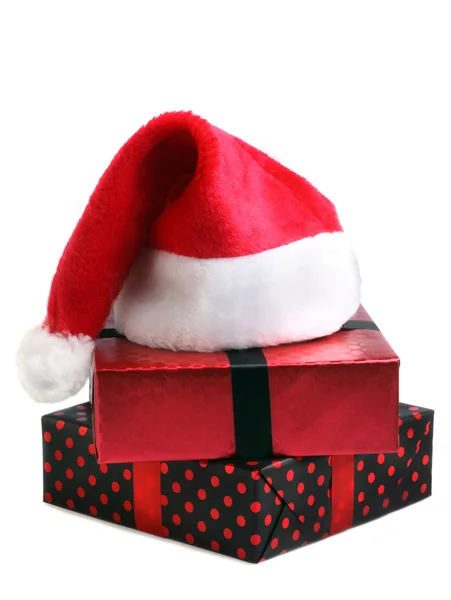 Christmas gift and santa hat — Stock Photo, Image