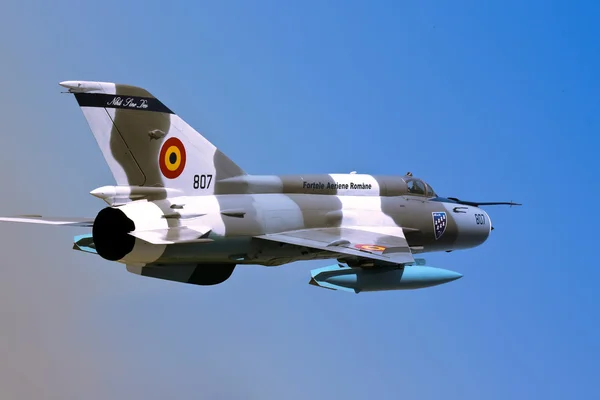 Stock image MiG 21 Romanian fighter aircraft isolated over blue sky