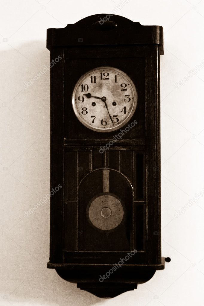 Very old wooden clock on the wall