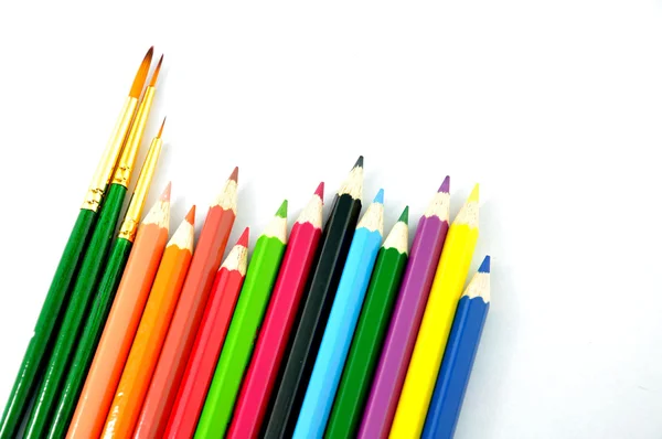 Bleistiftfarbe und Pinsel — Stockfoto