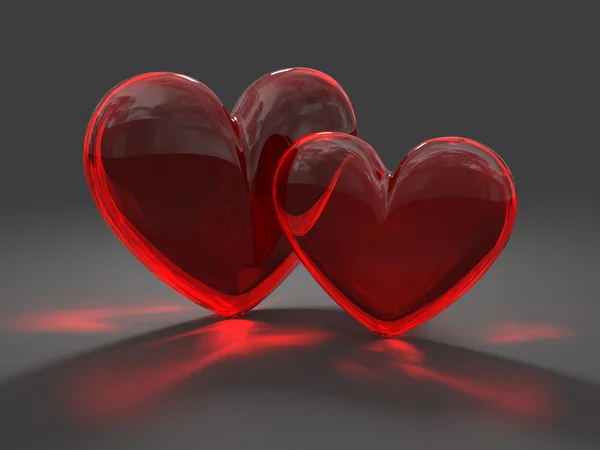 Twee glas rode hart met bijtende ingang — Stockfoto
