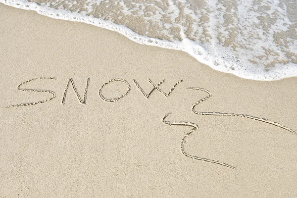 Written "snow" in the sand. — Stock Photo, Image